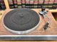 JBL TT350 Classic turntable on wooden hi-fi rack slight top down view in front of bookcase