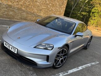 Porsche Taycan in silver parked in a car park