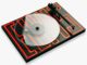 Black turntable with a transparent platter and red LED maze pattern on the base.